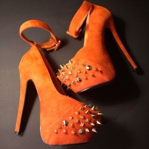 Orange spike heels